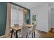 Dining room with modern lighting fixtures and backyard access at 2530 River Run Dr, Dacula, GA 30019