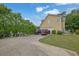 Spacious driveway provides ample parking leading to a two car garage, surrounded by lush landscaping at 2530 River Run Dr, Dacula, GA 30019