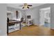This home office features wood floors, natural light, a desk, and a computer at 2530 River Run Dr, Dacula, GA 30019