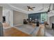 Large office space featuring built-in shelving, hardwood floors, fireplace, and a comfortable work environment at 2530 River Run Dr, Dacula, GA 30019