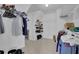 This walk-in closet has plenty of storage and shelves with room for clothes and accessories at 2530 River Run Dr, Dacula, GA 30019