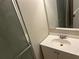 The bathroom has a glass shower and single sink at 6743 Timbers East Dr, Lithonia, GA 30058