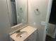 The bathroom has granite countertops, a mirror, and a sink at 6743 Timbers East Dr, Lithonia, GA 30058
