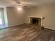 Living room featuring a fireplace, ceiling fan, and outdoor access at 6743 Timbers East Dr, Lithonia, GA 30058