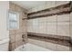 This bathroom features tile surround and shower and tub combo at 850 Fourth St, Stone Mountain, GA 30083