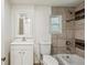 This bathroom features tile surround, vanity and toilet at 850 Fourth St, Stone Mountain, GA 30083