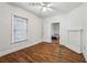 Bedroom with hardwood floors, window view and ceiling fan at 850 Fourth St, Stone Mountain, GA 30083