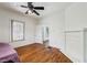 Bedroom with ceiling fan, hardwood floors and fireplace at 850 Fourth St, Stone Mountain, GA 30083