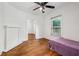 Bedroom with hardwood flooring, ceiling fan, and decorative fireplace at 850 Fourth St, Stone Mountain, GA 30083