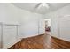 Bedroom with fireplace, hardwood floors, and access to the kitchen at 850 Fourth St, Stone Mountain, GA 30083