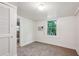 The bedroom has carpet, a window and a closet at 850 Fourth St, Stone Mountain, GA 30083