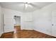 Bedroom with hardwood floors, ceiling fan and view into other rooms at 850 Fourth St, Stone Mountain, GA 30083