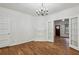 Spacious dining room featuring a classic chandelier and French doors that flood the room with light at 850 Fourth St, Stone Mountain, GA 30083