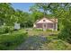 Charming cottage-style home with a screened-in porch and a well-manicured lawn at 850 Fourth St, Stone Mountain, GA 30083