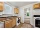 The kitchen has tile floors, wood cabinets and a window over the sink at 850 Fourth St, Stone Mountain, GA 30083