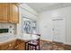Eat-in kitchen nook with tile counters, wood cabinets and window view at 850 Fourth St, Stone Mountain, GA 30083