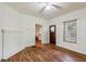 Cozy living room featuring original hardwood floors, a decorative fireplace, and ample natural light at 850 Fourth St, Stone Mountain, GA 30083