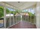 Screened-in porch offers a relaxing outdoor space with tile flooring at 850 Fourth St, Stone Mountain, GA 30083