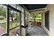 Relaxing screened porch with a swing, offering a cozy outdoor space to enjoy the peaceful surroundings at 850 Fourth St, Stone Mountain, GA 30083