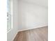 Bedroom showcasing a window and neutral walls, with vinyl wood-style floors at 1452 Stephens View Dr, Loganville, GA 30052