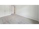 An empty bedroom with carpet flooring, white walls, and a closet with double doors at 1452 Stephens View Dr, Loganville, GA 30052