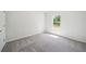 Bright bedroom features carpeted floors, fresh paint, and large window at 1452 Stephens View Dr, Loganville, GA 30052