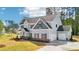 Charming two-story home with a two car garage and lush green lawn at 1452 Stephens View Dr, Loganville, GA 30052