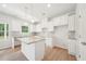 Modern kitchen featuring a spacious island and white cabinets at 1452 Stephens View Dr, Loganville, GA 30052