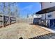 Fenced backyard with an outdoor dining set and a large umbrella at 2132 Arnage Dr, Lithonia, GA 30058