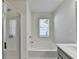 Bright bathroom featuring a soaking tub and a separate shower at 2132 Arnage Dr, Lithonia, GA 30058