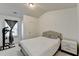 A bedroom with a full size bed, a small nightstand and a workout machine at 2132 Arnage Dr, Lithonia, GA 30058