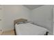 Small bedroom featuring a simple bed with a cushioned headboard and a white nightstand at 2132 Arnage Dr, Lithonia, GA 30058