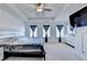 Spacious bedroom with plush carpeting, three windows and a large dresser at 2132 Arnage Dr, Lithonia, GA 30058