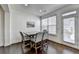 A formal dining area features great natural light and hardwood flooring at 2132 Arnage Dr, Lithonia, GA 30058