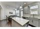 Spacious kitchen with center island and hardwood floors next to the dining area at 2132 Arnage Dr, Lithonia, GA 30058