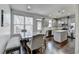 Kitchen and dining area featuring stainless steel appliances and grey cabinetry at 2132 Arnage Dr, Lithonia, GA 30058