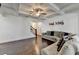 Spacious living room with coffered ceiling and hardwood floors connecting to the staircase at 2132 Arnage Dr, Lithonia, GA 30058