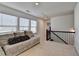 Bright loft with comfortable seating and a staircase at 2132 Arnage Dr, Lithonia, GA 30058