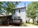Enjoy the large private backyard with a spacious wooden deck, mature trees and a privacy fence at 3474 Kingswood Run, Decatur, GA 30034