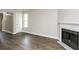 Bright living room with hardwood floors and a fireplace at 3474 Kingswood Run, Decatur, GA 30034