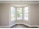Bright living room featuring hardwood floors, modern trim and large bay window at 3474 Kingswood Run, Decatur, GA 30034