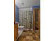 Bathroom featuring a shower with a charming patterned shower curtain at 6605 Old White Mill Rd, Fairburn, GA 30213