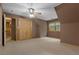 Bedroom with angled ceiling, carpeted floors, closet, and a window providing natural light at 6605 Old White Mill Rd, Fairburn, GA 30213