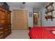 Bulldogs themed room featuring a red comforter, a ceiling fan, and sports decor, ideal for fans at 6605 Old White Mill Rd, Fairburn, GA 30213