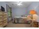 Light-filled bedroom with a cozy quilt, vintage dresser, and soft, inviting decor at 6605 Old White Mill Rd, Fairburn, GA 30213