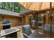 Outdoor deck with grill, dining, and seating; perfect for enjoying the wooded setting with views of nature at 6605 Old White Mill Rd, Fairburn, GA 30213