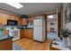 Well-equipped kitchen with wood cabinets and efficient appliances at 6605 Old White Mill Rd, Fairburn, GA 30213