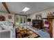 Cozy living room with a fireplace and convenient access to the outdoors at 6605 Old White Mill Rd, Fairburn, GA 30213