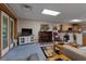Cozy living room with fireplace, TV, and access to outdoor space at 6605 Old White Mill Rd, Fairburn, GA 30213