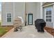Back patio includes an outdoor sofa and grill perfect for relaxation and outdoor cooking at 701 Fir Chase, Fairburn, GA 30213